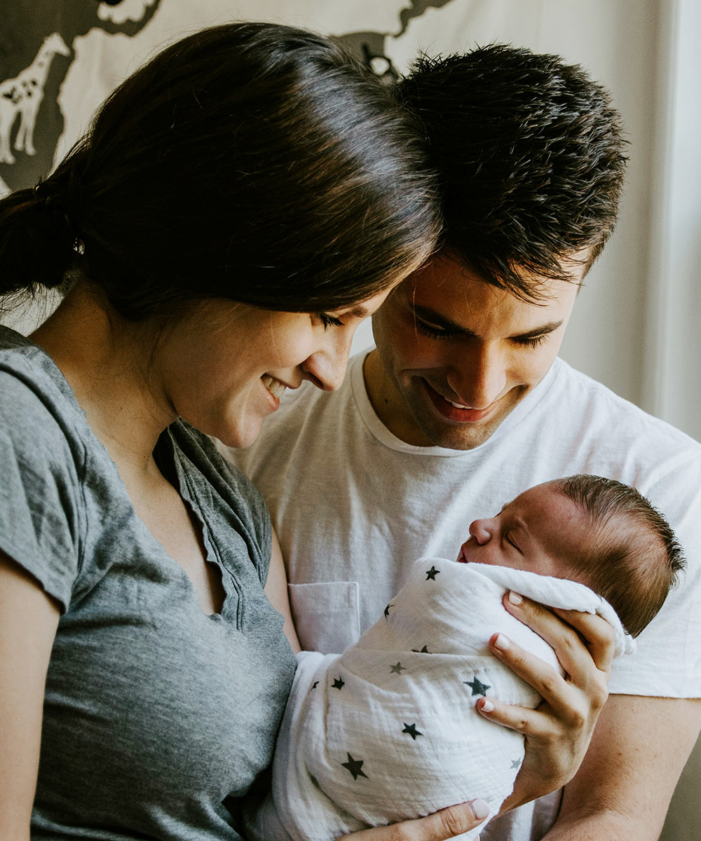 Parents holding their newborn baby