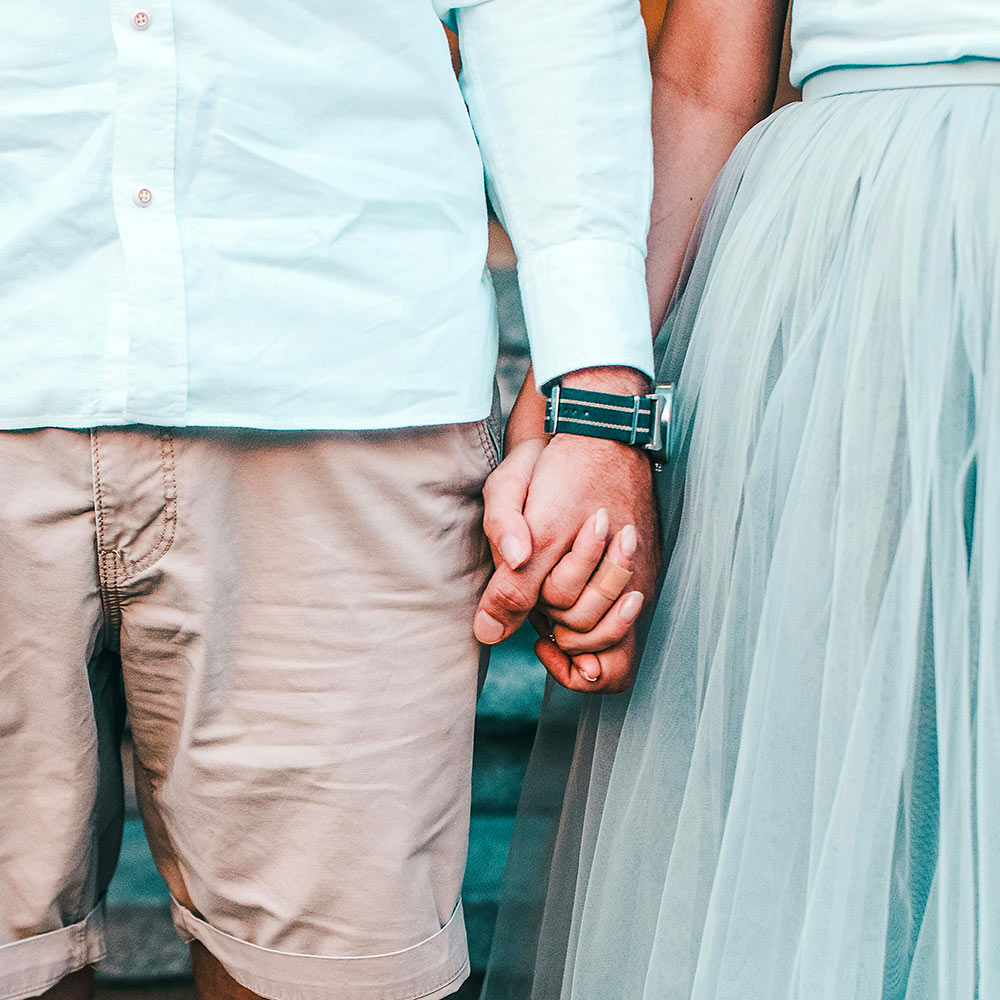 Couple holding hands