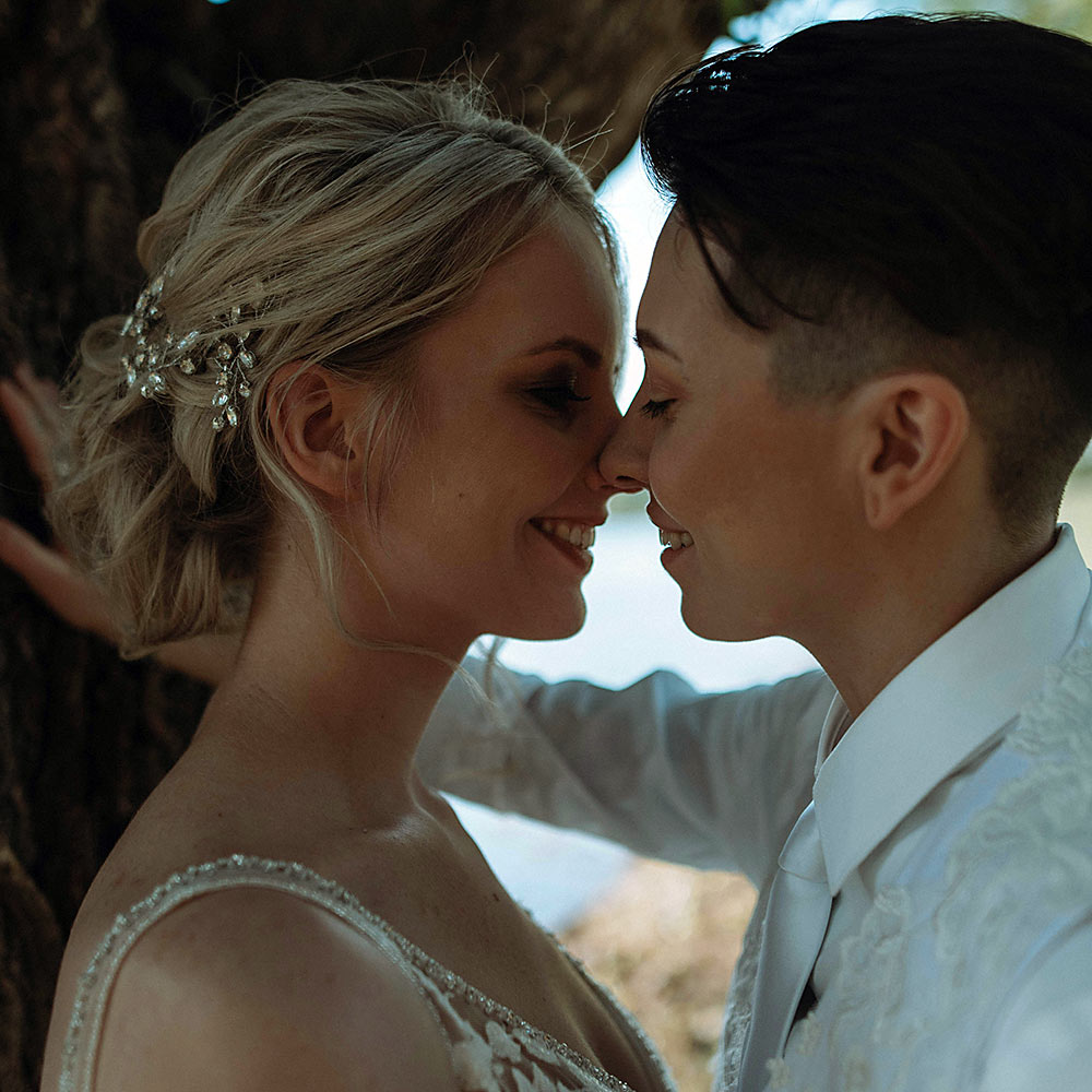 Two brides smiling together