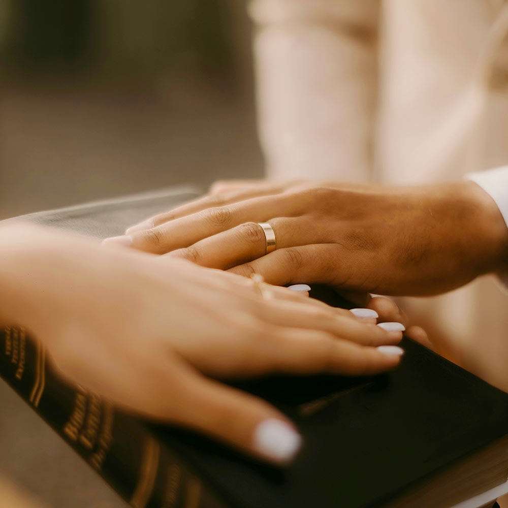 Newlyweds showing their wedding rings